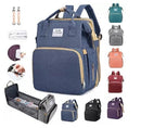 Mochila Mudador 2 en 1 | Puerto USB | Colchoneta Cambiador Incluida | Morado, Rojo y Azul